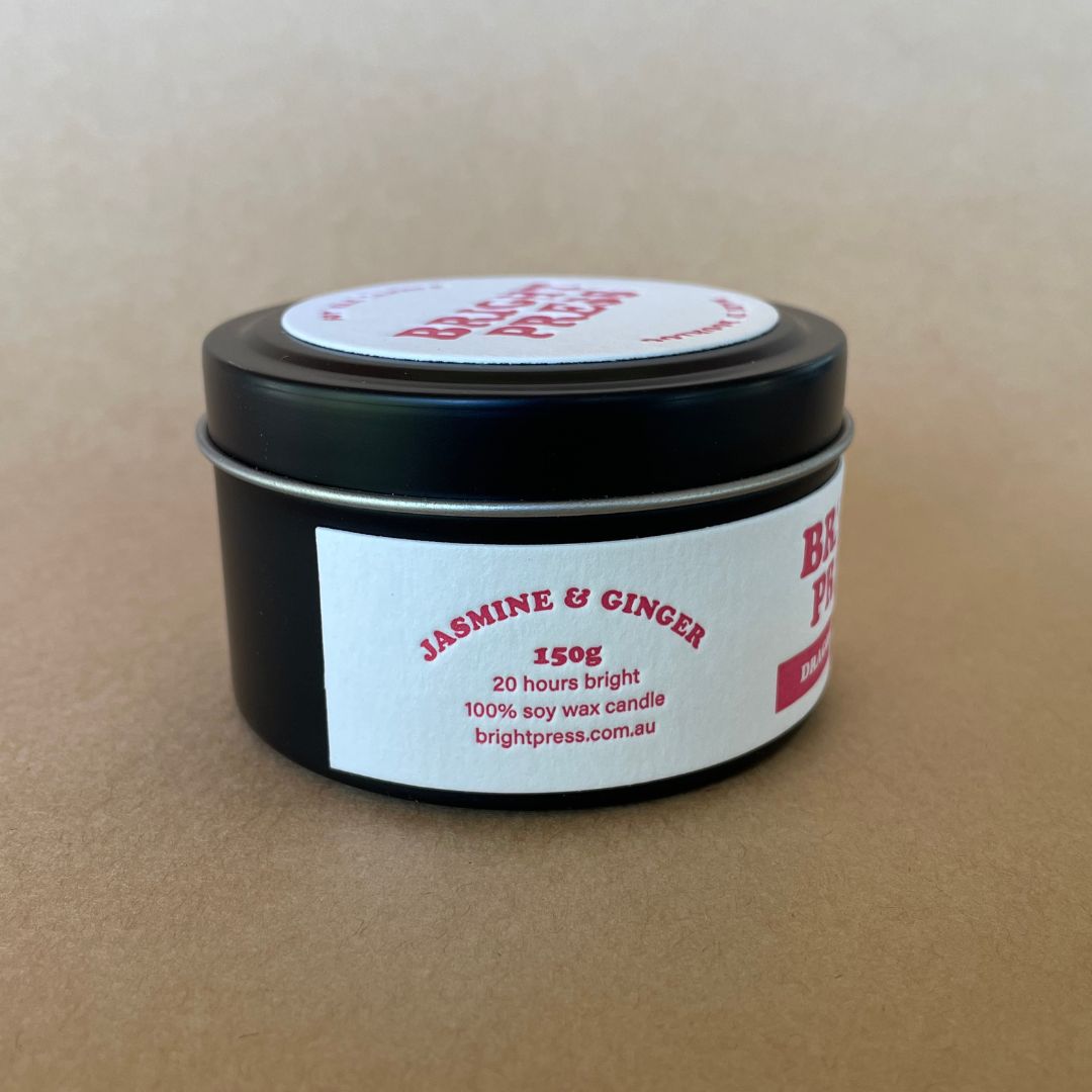 Side view of Dragon's Breath Soy Wax Candle featuring text describing the scent - Jasmine & Ginger