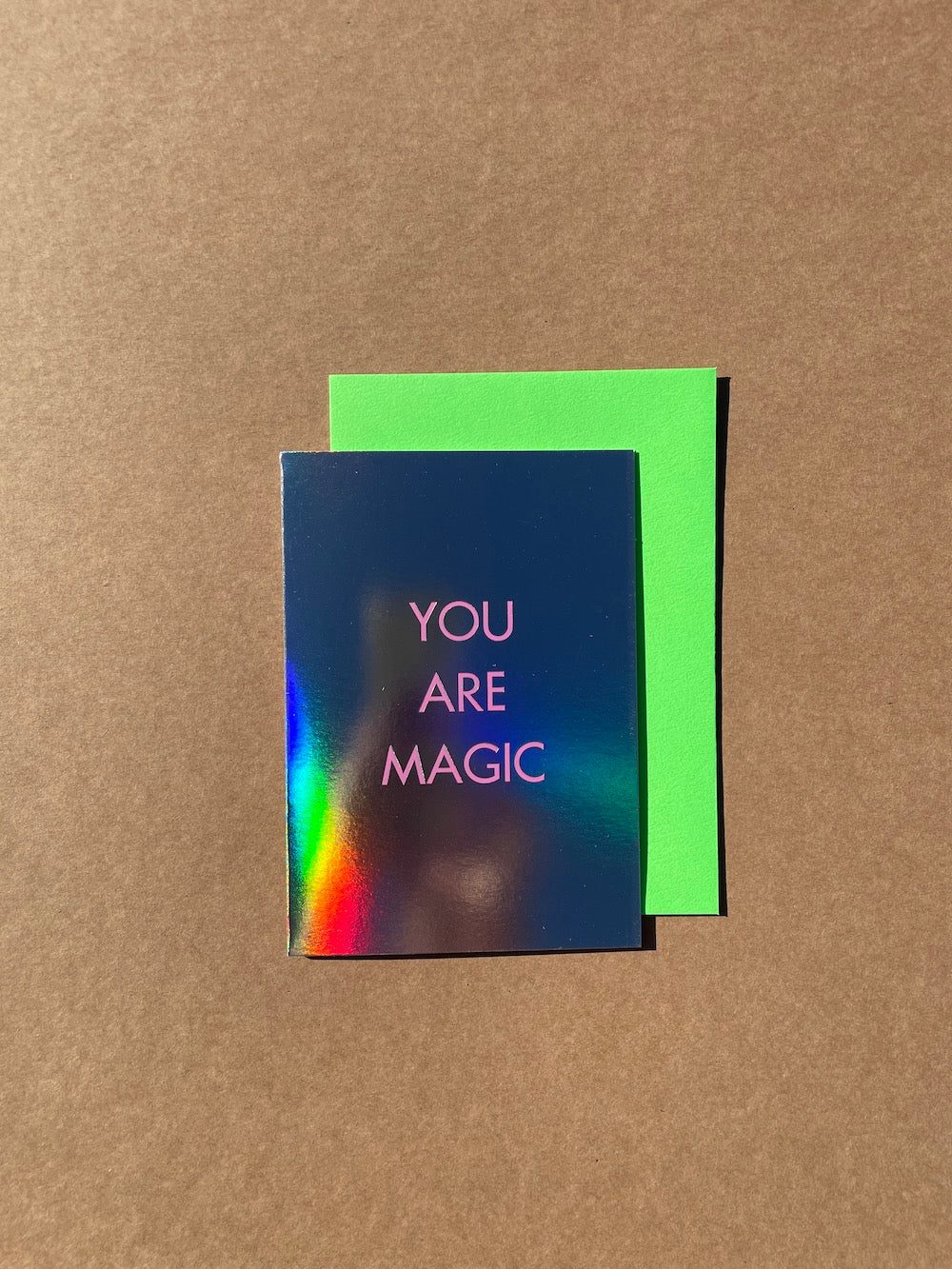 You Are Magic Card. Text reading "You Are Magic" printed on mega shiny card stock, so shiny, you can see Ann's arm in the reflection as she attempted to take the photo.