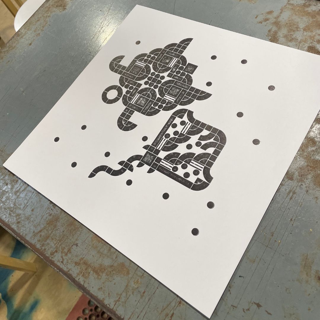 A freshly printed lego letterpress print featuring a sea turtle and a manta ray.