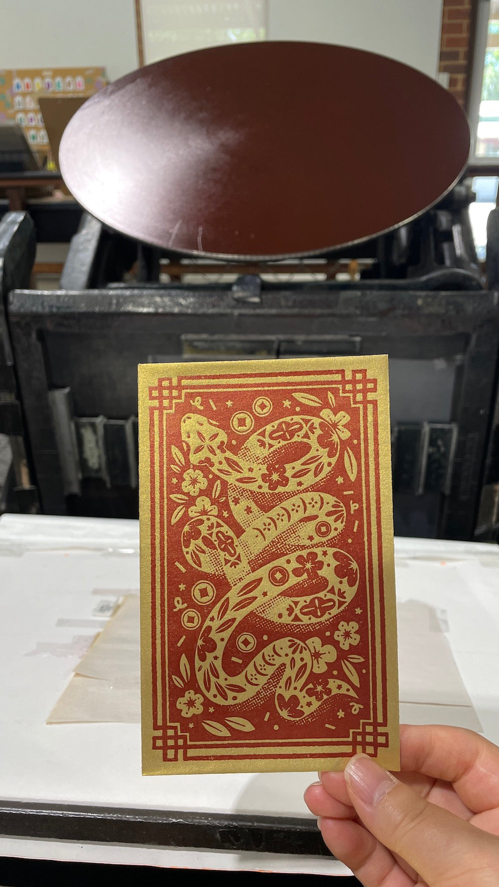 A Year of the Snake Red Packet freshly printed on our 1928 Chandler and Price press.